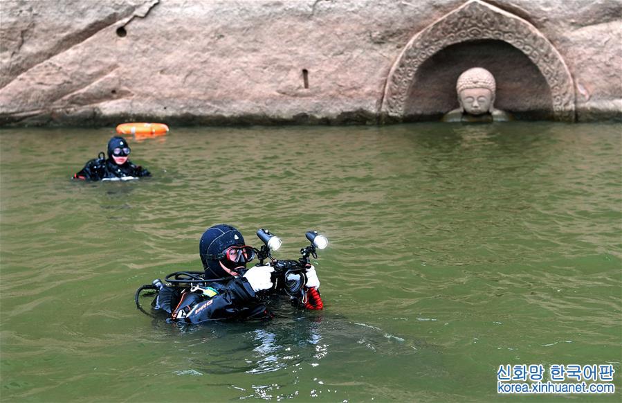 （文化）（6）江西南城一水库发现摩崖造像 “佛头”遗迹浮出水面