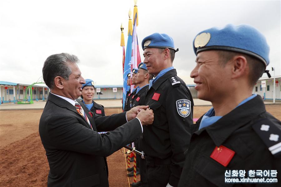 （国际·图文互动）（1）联合国授予中国第五支驻利比里亚维和警察防暴队全体队员和平勋章