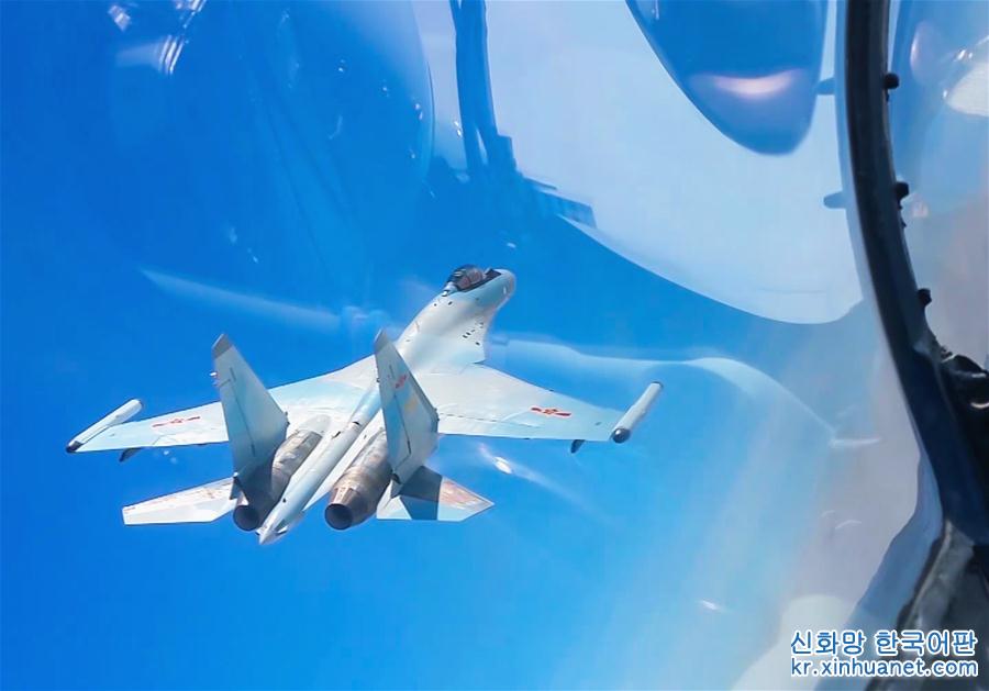 （图文互动）（1）中国空军轰－6K等多型战机远洋训练战巡南海